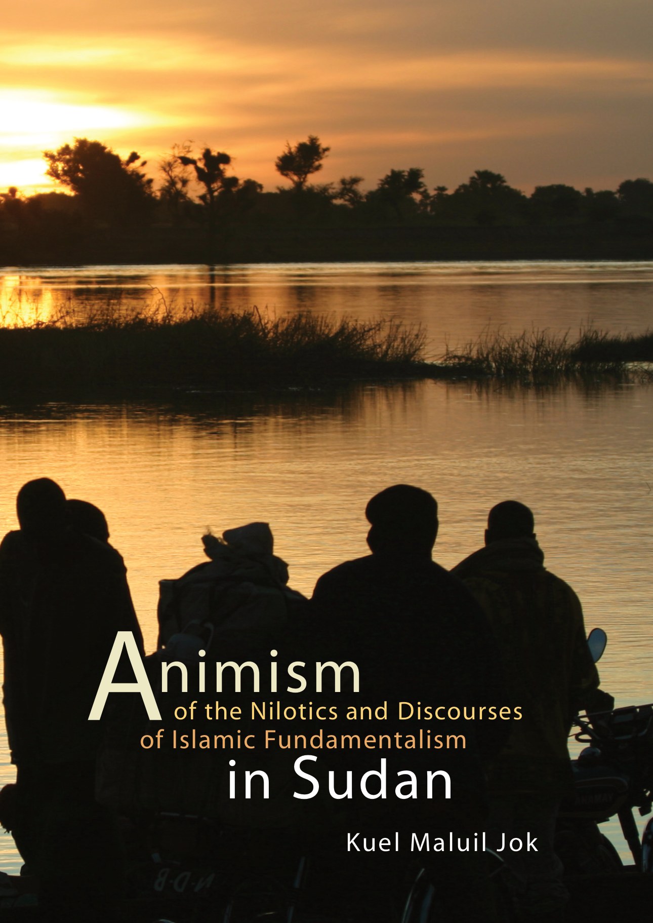 Cover of Animism of the Nilotics: people in silhouette on the bank of the Nile at sunset